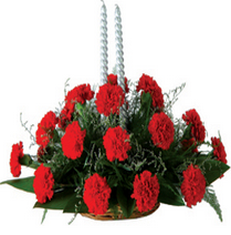 Oval arrangement of carnation with candles