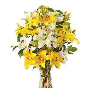 yellow rose asiatic lilies set in a glass vase