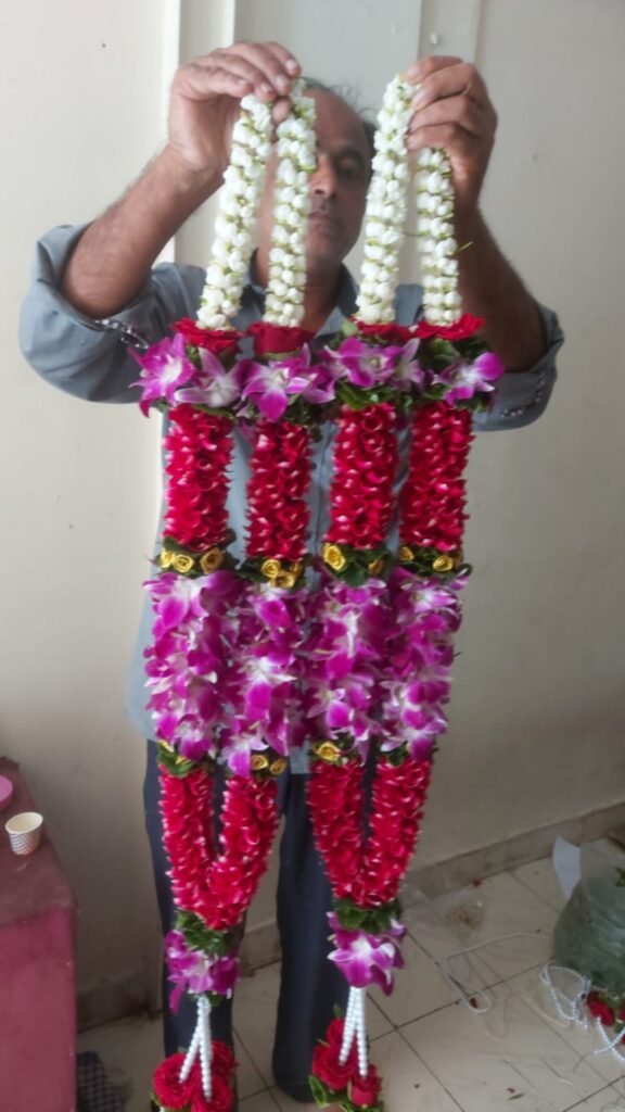 Wedding Rose petals Garland, Orchid Jaimala price, Rose Jaimala, New Style Jaimala, Orchid Flower Jaimala near me shop, Tube Roses jaimala , rajnigandha and roses Jaimala , jasmine and lilly varmala garlands price , virat kohli jaimala varmala haar, buy pink and white jaimala online price  , red and white flower varmala, blue orchid jaimala, purple orchid varmala ,  special rose petals jaimala near me